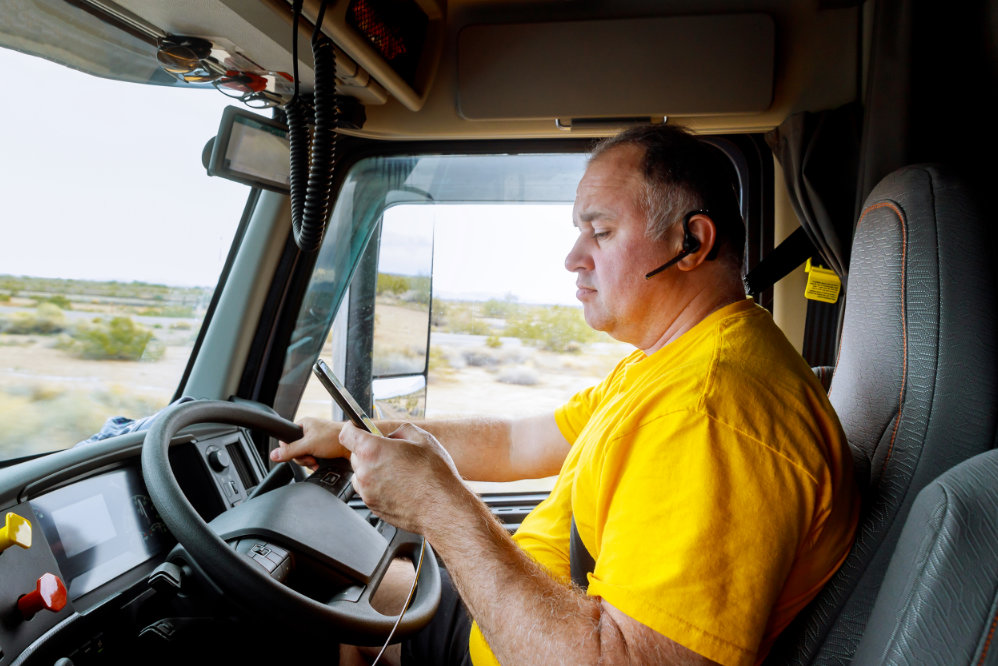 USost - truck driver checks his phone